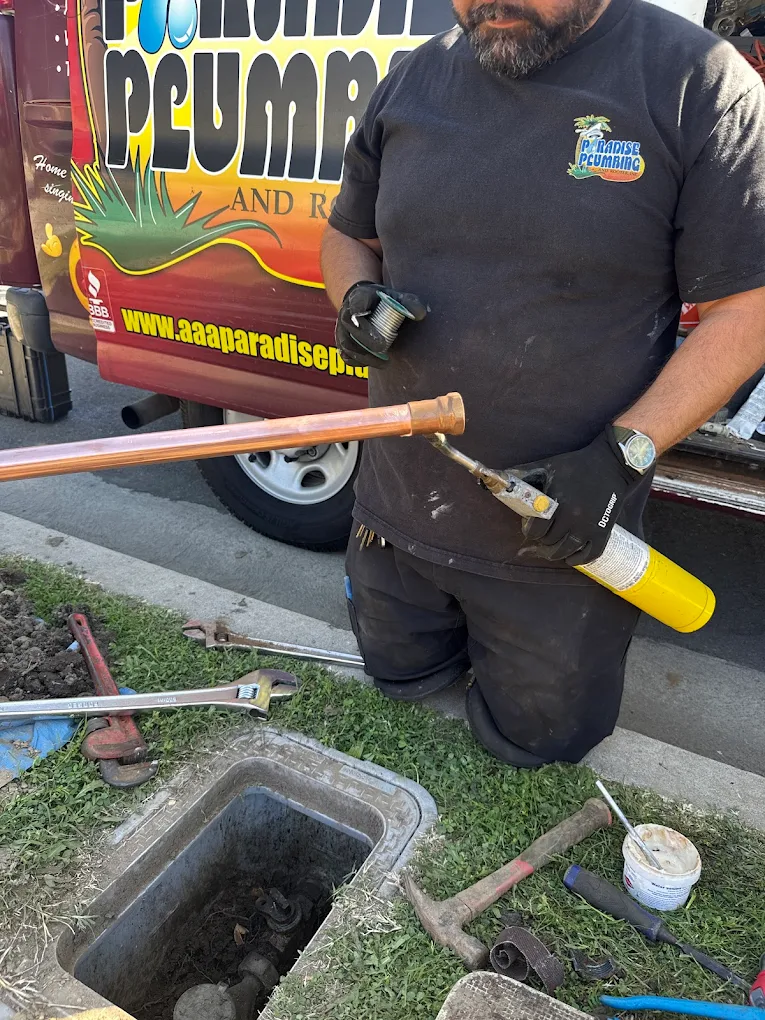 Plumber performing professional drain cleaning in a Ventura home