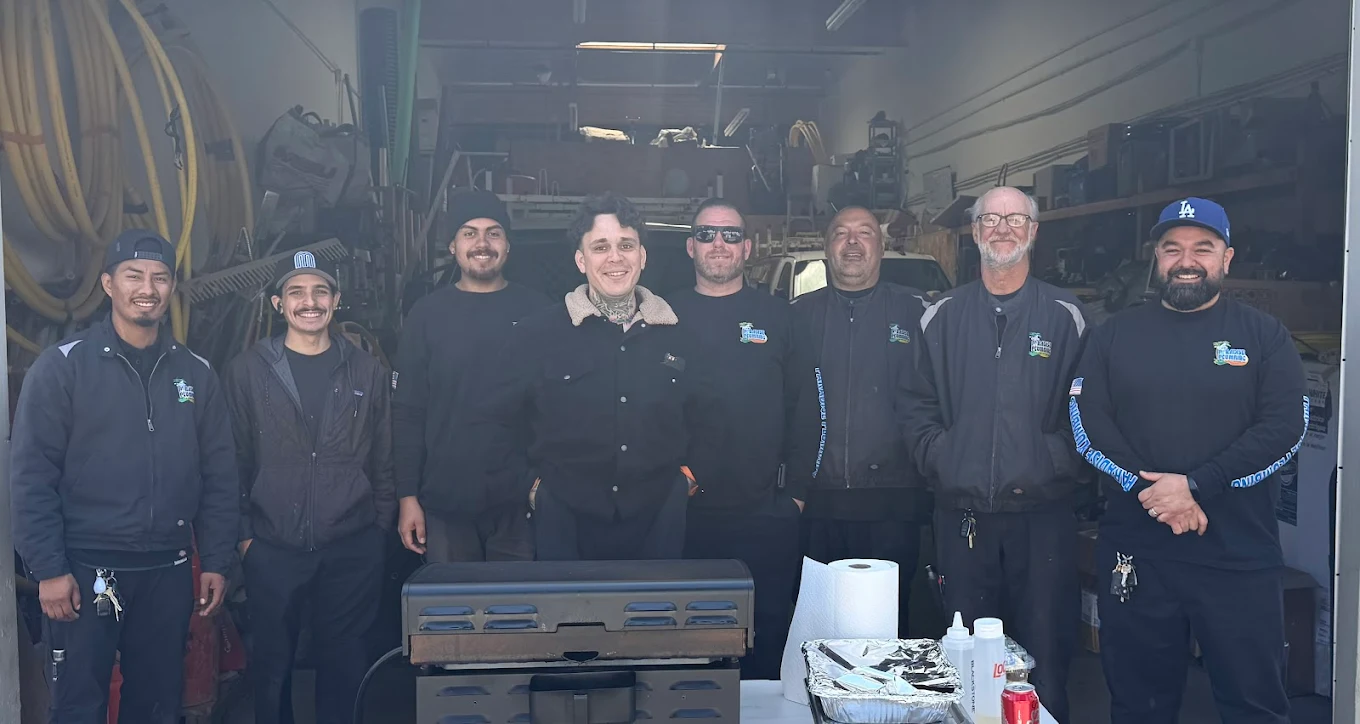 The AAA Paradise Plumbing & Rooter crew gathered in the Ventura warehouse &mdash; nine technicians in branded Paradise Plumbing apparel, the longtime team of a family-owned business since 1976