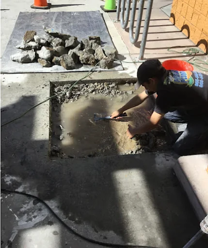 AAA Paradise Plumbing technician repairing a slab leak through a surgical access cut in a Ventura, CA home