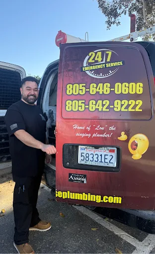 Senior plumber from AAA Paradise Plumbing & Rooter standing in front of a branded service van — 24/7 Emergency Service